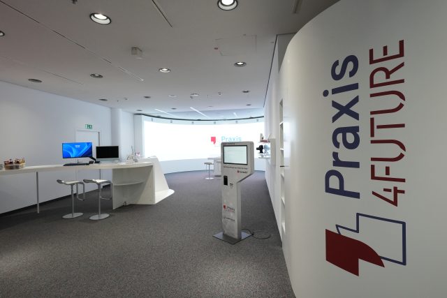 A medical center with white walls and a bright LED screen of INFiLED