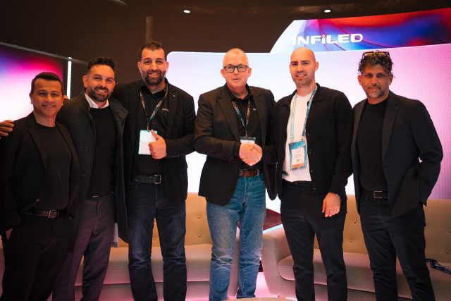 A group of man shaking hands