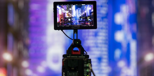 A cinema camera filming an LED wall on the INFiLED booth at NAB Show 2025