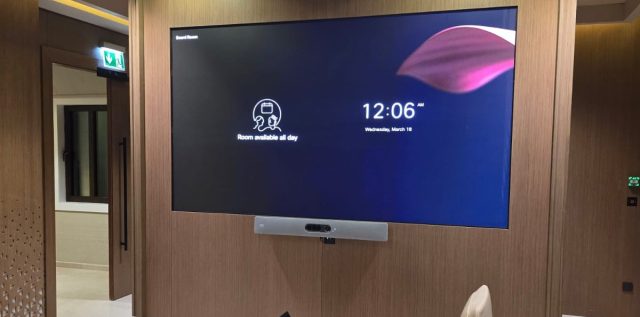 INFiLED WP Series LED video wall in the boardroom of Saudi Arabia's Ministry of Culture, set into a wood-panelled wall above a video conferencing bar.